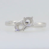 Sterling silver semi mount ring setting with round 5x5mm spots for two stones in a bypass design.
